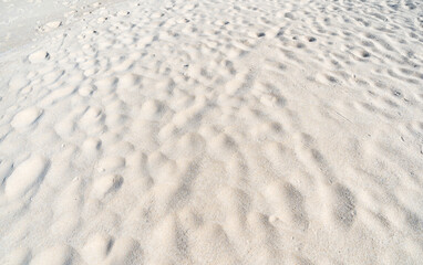 Natural Texture of Sand beach with wave curve of sand on beach in sunny day Image for nature travel background Summer Design concept