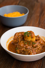 sous vide beef shank with tomato herb sauce and mashed sweet pumpkin
