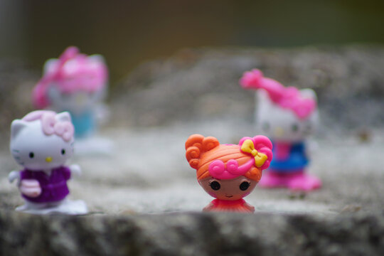 Phto of cute little doll with blurry bokeh backgroud.