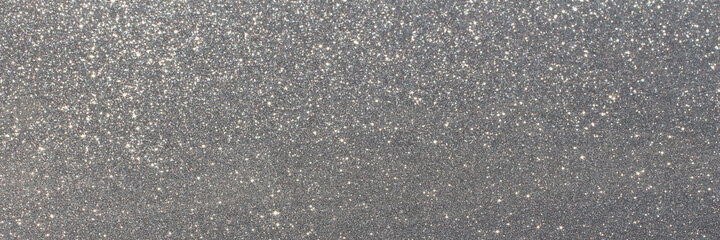 White and grey glitter bokeh circle glow blurred and blur abstract. Glittering shimmer bright luxury. White and silver glisten twinkle for texture wallpaper and background backdrop.
