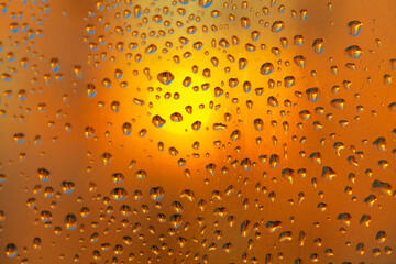 Water drops on the glass in the sunlight