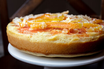 Orange Upside Down Cake with Candied Orange and Lemon Rind on a Plate