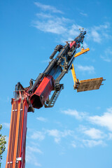 Boom Crane Being Used for a Roofing Project on a Residential Home