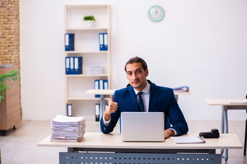 Young male employee working in the office