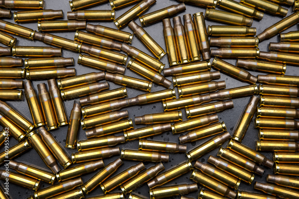 Sticker Background from empty used ammunition cases. Military back for poster or postcard.