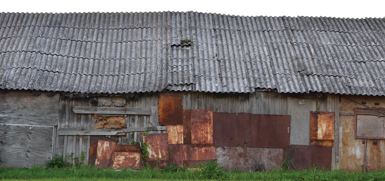 Old aged weathered wooden shack, grey plated wood boarding hut wall, patched planks rusted metal plates rusty paint texture isolated panorama grunge zinced coat iron steel zinc patches slated rooftop