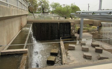 The restored hydroelectric plant in Phoenix with small waterfalls called Arizona Falls on a cloudy day 