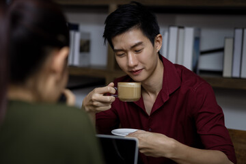 young asian people and friends meeting about work in a cafe house Thailand