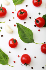 Tomato, basil, spices, pepper, garlic. Vegan diet food, creative cherry tomato composition isolated on white.