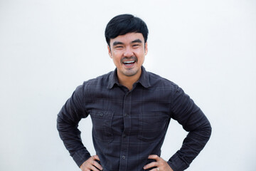 Fototapeta premium adult asian man.young male person.posing smiling laughing look excited surprised thinking positive happy.empty,copy space for text advertising.white background.attractive fashion