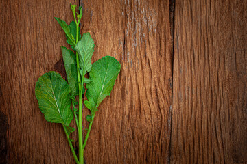 Bio food. green Lettuce leaves pattern on old wooden background, copy space