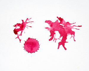 Red watercolor splashes on the white background