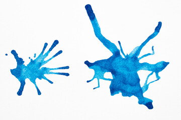 Blue watercolor splashes on the white background