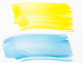 Yellow and blue watercolor brush strokes on white background