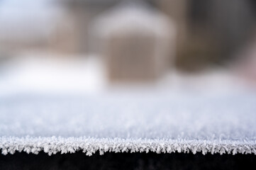 Subjective focus on crystalized frost on the edge of a metal box