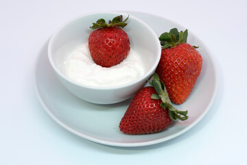 Strawberries and natural yogurt