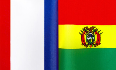 fragments of the national flags of France and the State of Bolivia close-up