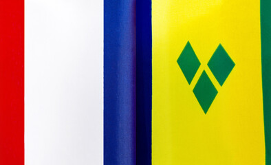 fragments of the national flags of France and Saint Vincent and the Grenadines close-up