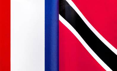 fragments of the national flags of France and the Republic of Trinidad and Tobago close-up
