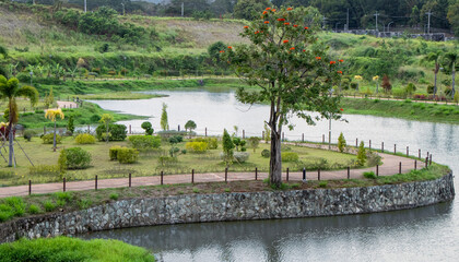 Curved Pedestrian Path in Lush Tropical Park next to Large Pond - Clark, Pampanga, Luzon, Philippines