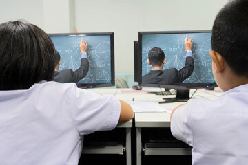 Obraz premium Young student watching lesson online and studying from home.