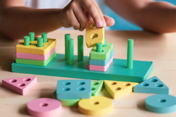 boy playing children toys for learning for skills