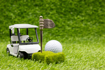 Golf cart with golf ball at 19th hole
