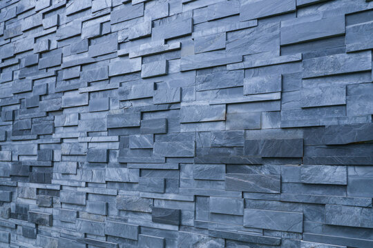 Pieces of stone wall for background or texture, gray pattern of modern design style, real stone wall with layered black