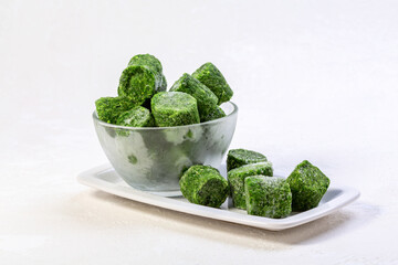 Frozen spinach in briquettes.