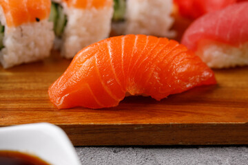 Philadelphia roll with cucumber and sushi with salmon and tuna. Sushi menu. Japanese food.