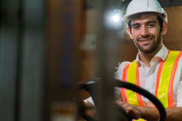 engineer staff male warehouse worker in hard hat working. walking through logistics center...