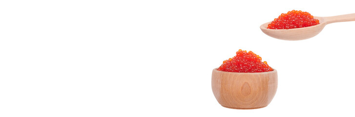 Luxury red caviar on wooden spoon, expensive healthy seafood, isolated on white background.