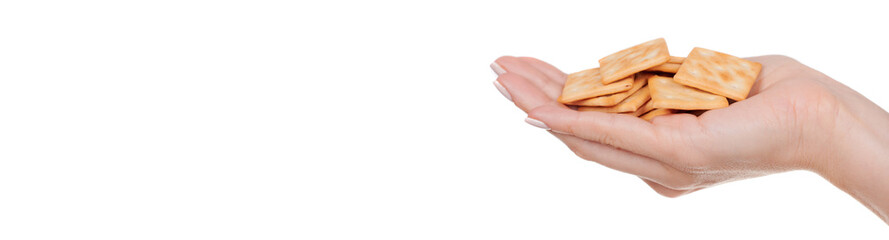Hand with square crackers with holes, isolated on white background.
