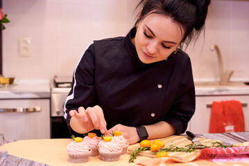 Young woman prepare cupcakes on home kitchen.