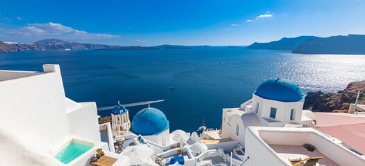 Beautiful Oia town on Santorini island, Greece. Traditional white architecture and Greek orthodox...