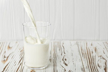 milk pouring into glass