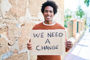 Young handsome african american man asking for change smiling happy. Standing with smile on face...