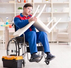 Disabled man repairing chair in workshop