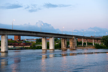 A bridge over the Kostroma river on a summer evening. View from the Ipatiev Monastery