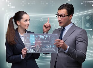 Pair of businessman and businesswoman discussing data