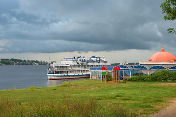 Cruise ship at the pier on the Volga river in the city of Kostroma on a summer evening