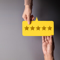 Customer Experience Concept, Happy Client giving Five Star Rating Feedback on Card to a...