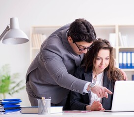 Sexual harassment concept with man and woman in office