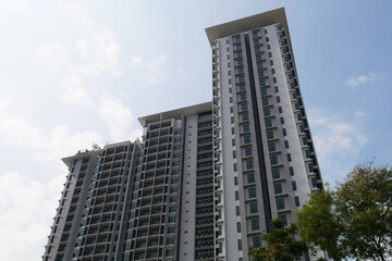 Fototapeta na wymiar SELANGOR, MALAYSIA -JULY 22, 2020: High rise apartment building with modern facade design. Popular in the urban areas in Malaysia. Various facilities for the use of the residents are provided.
