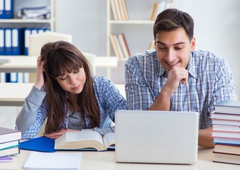 Students sitting and studying in classroom college