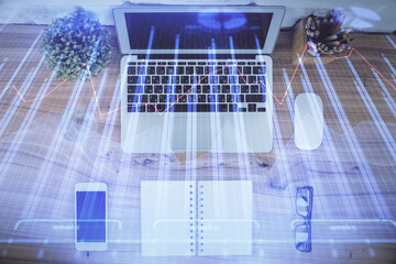 Multi exposure of financial chart drawing over table background with computer. Concept of research....