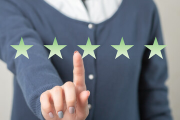 Women's hands and star rating icon