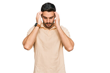 Young hispanic man wearing casual clothes suffering from headache desperate and stressed because pain and migraine. hands on head.