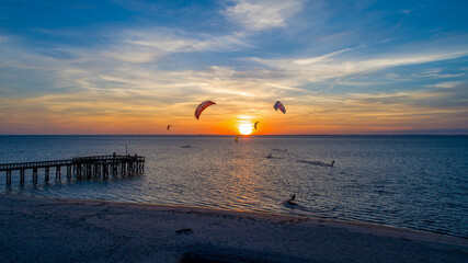 Kite surfing at sunset 