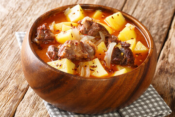 lamb stew and potato with onions close-up in a bowl on the table. horizontal